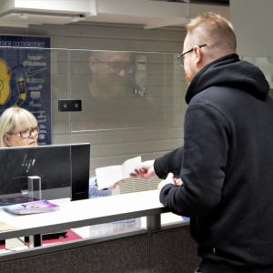 A customer visiting the Sports Services` customer service point.