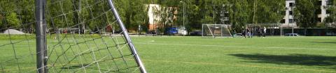  Soccer goal and green artificial turf.