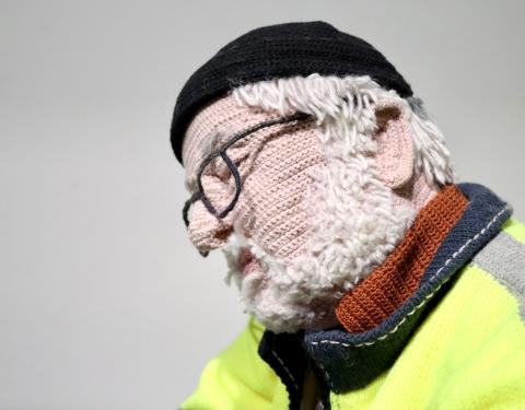 Knitted art piece of an old man.