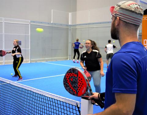 Young people playing padel.