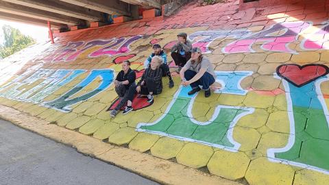 Young artists pictured after they painted a huge mural at Friendship Bridge in Tartu