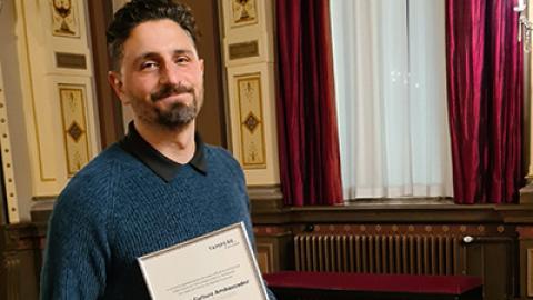 Aram Tertzakian at Tampere Old City Hall with Tampere Culture Ambassador certificate