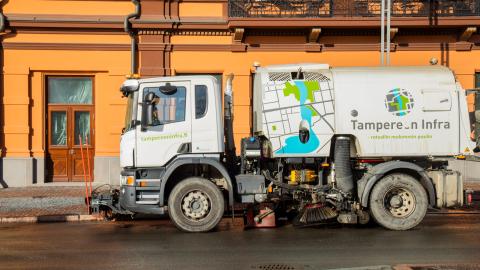 Tampere Infra cleaning truck on the street.