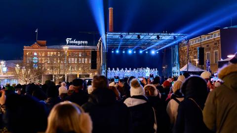 People watching a performance at the central square.