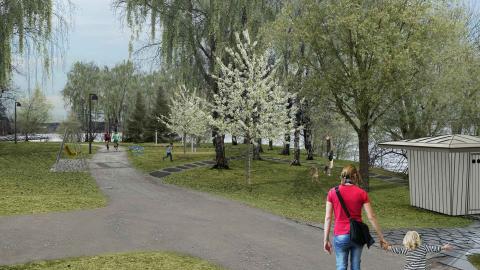 Vanhempi ja lapsi Koukkuniemenpuiston rantareitillä.