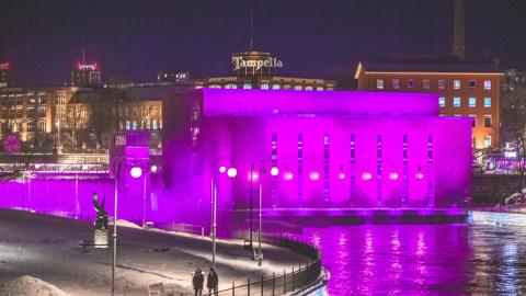 Tammerkoski illuminated in purple.