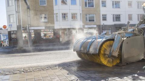 A street sweeper collects grit from the streets in the spring.