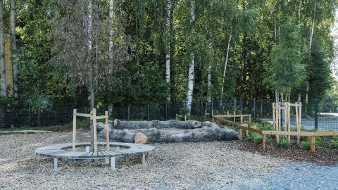 The playground at Metsäniitty Early Childhood Education and Care Centre in the summer.