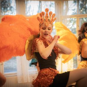 Three samba dancers danced in their colorful costumes.