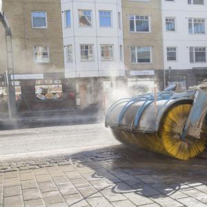 A street sweeper collects grit from the streets in the spring.