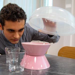 Carnesella Riccardo places a microwave bowl over the kitchenware.