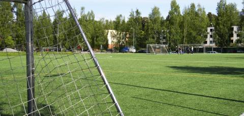 Soccer goal and green artificial turf.