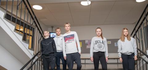 Young people walking down in stairs.
