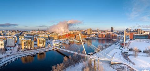 Scenery of Tampere in winter, Laukonsilta bridge and Tampere Stadium.