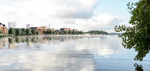 Järven rannalla uusia asuinrakennuksia, puista ja rantareitti.