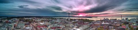 Drone view of the Tampere city center in the evening with dramatic looking clouds in the sky.