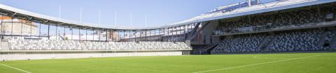 The Tammela stadium, green football field on the front.