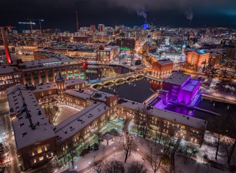 Frenckell properties and the illuminated power plant and Tammerkoski at night.