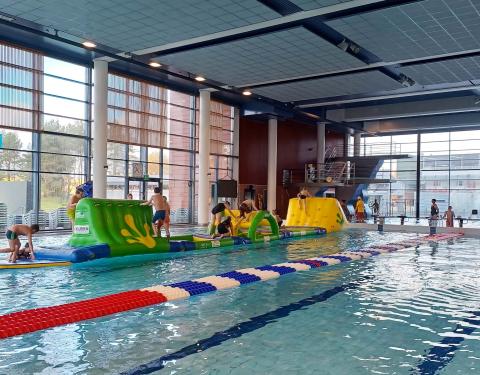 A wibit track and children in the swimming pool.