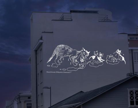 Muumivalaistus talon seinässä.