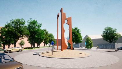 Kuva liikenneympyrästä, jonka keskellä nousee neljä silhuettimaista pylvästä.