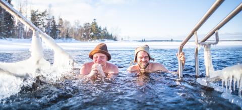 Friends ice swimming in Rauhaniemi
