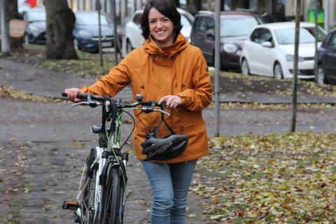 Celine Kylänpää walks her bike in Pyynikki area in Tampere