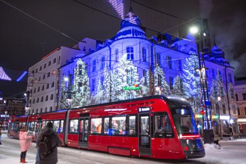 A tram passes Keskustori Central Market at Christmas time.