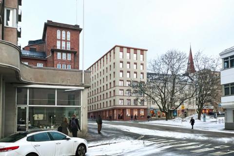 Kuvassa vanhaa kaupunkirakennetta ja uusi talo.