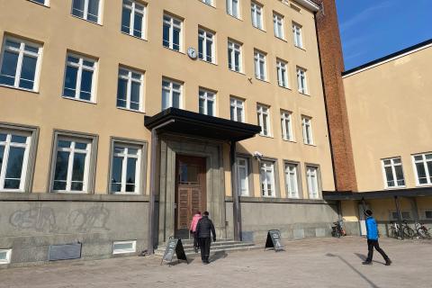 People entering through the main entrance of the Nekala Cultural Centre.