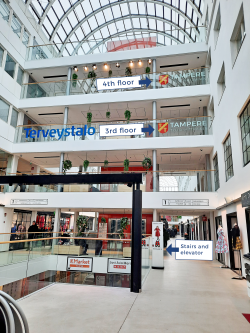 Picture from inside Tullintori shopping center. The image shows different floors and their markings. The ‘Work and Entrepreneurship’ markings are on the 3rd and 4th floors.