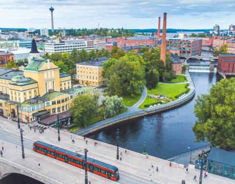 Tramway on Hämeensilta bridge in Tammerkoski rapids scenery.