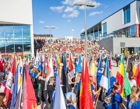 Young international athletes with national flags in IIAAF championship's opening ceremony in Ratina area.